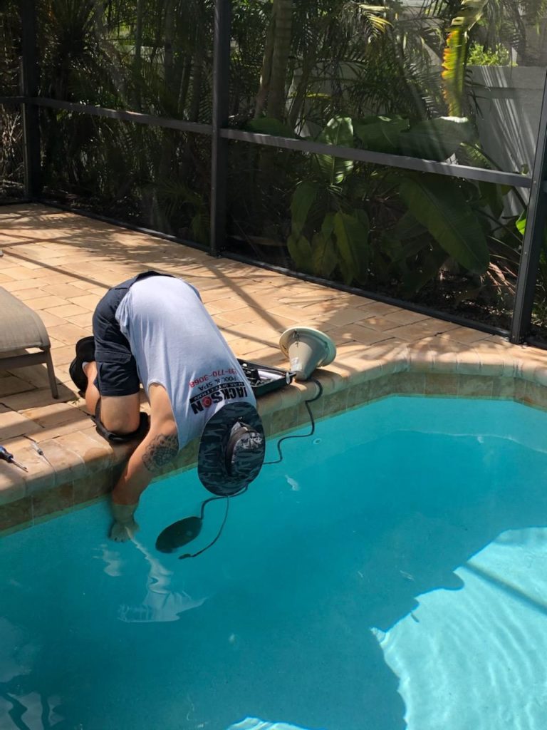 Cape checking the pool light for a leak | Coral pool leak detection